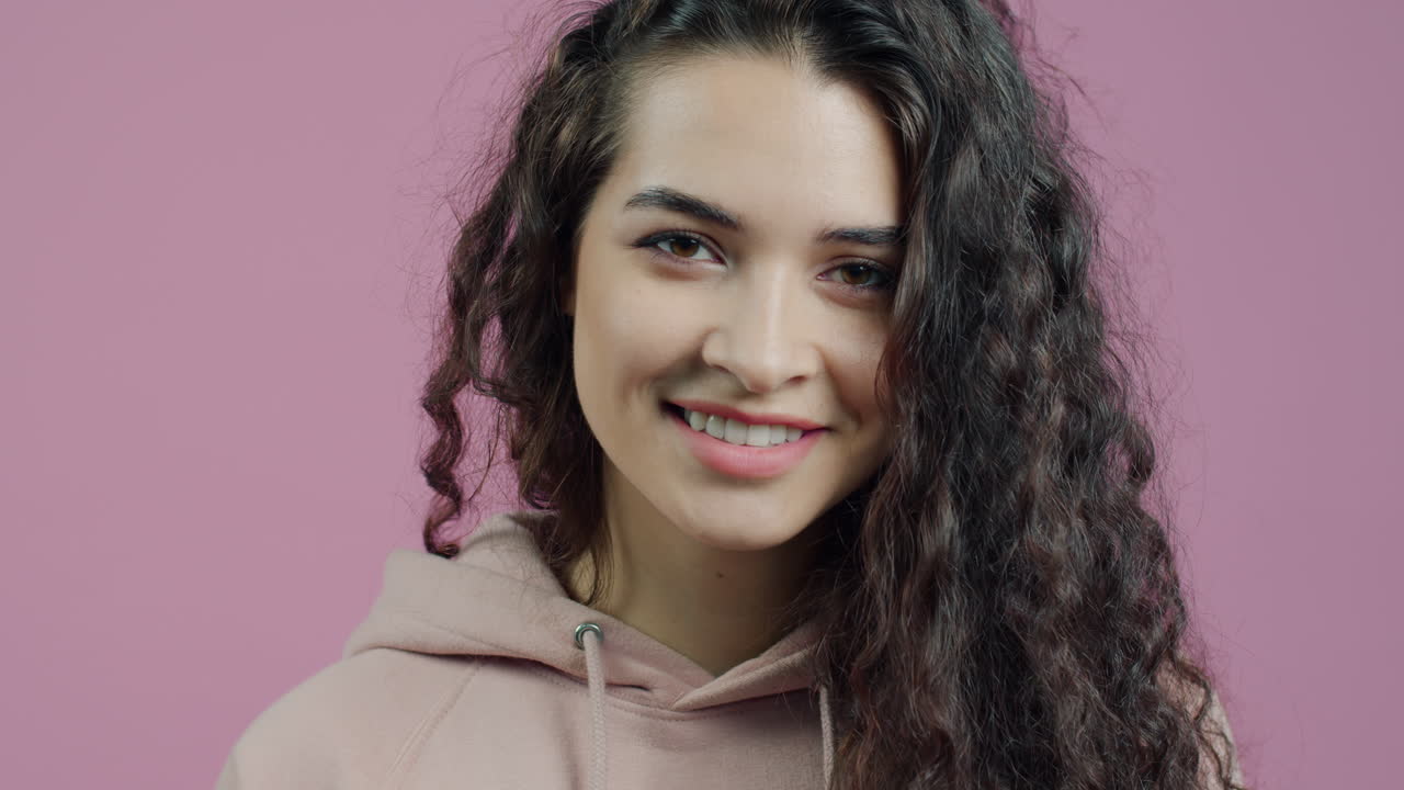 Woman smiling and giving the ok sign