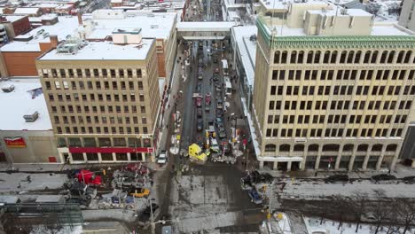 large trucks from the freedom convoy block multiple intersections in ottawa's snowy city center to protest mandatory vaccination