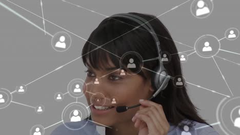 Animation-of-networks-of-connections-with-icons-over-businesswoman-using-phone-headsets