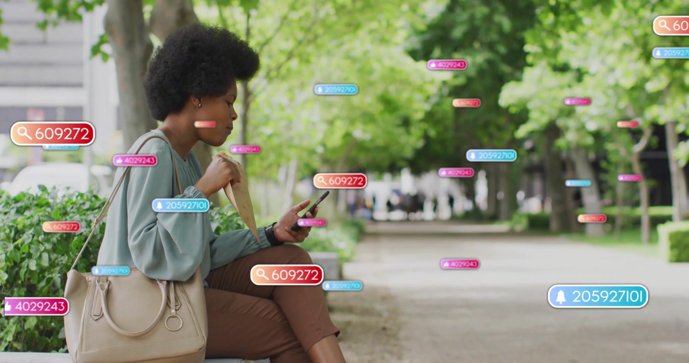 Mid-adult woman scrolling phone and checking alerts, causing tech badges fanning down path