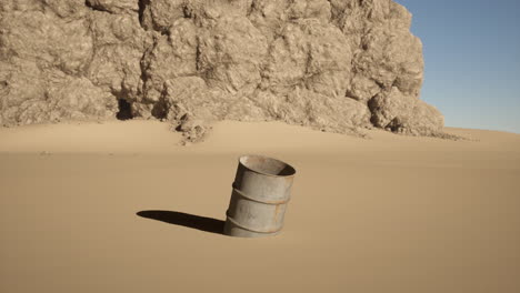 rusty barrel in a desert landscape