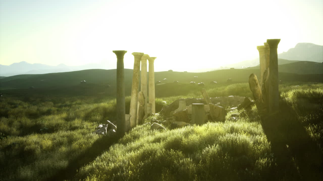 Ancient ruins stand in the sunlit field surrounded by green landscape