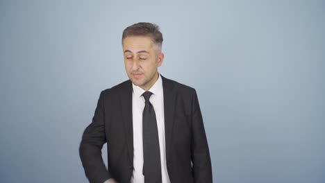 stressed businessman loosens his tie.