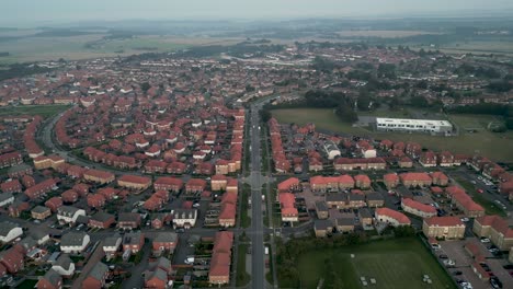 Drone-shot-flying-over-the-Kent-Village-of-Aylesham-showing-lots-of-houses