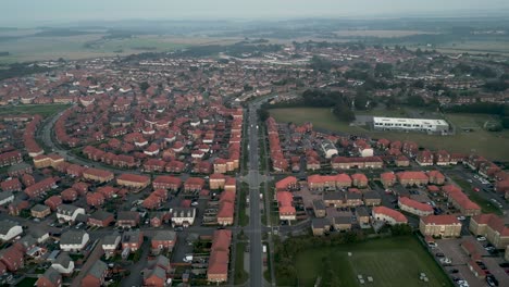 drone shot flying over the kent village of aylesham showing lots of houses