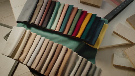 Designer-workplace---Palettes-with-fabric-samples,-wood-samples-for-furniture---selection-of-building-and-finishing-materials-for-designer-renovation