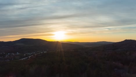 beautiful sunset over mountain town in new england drone aerial time lapse 4k 30p