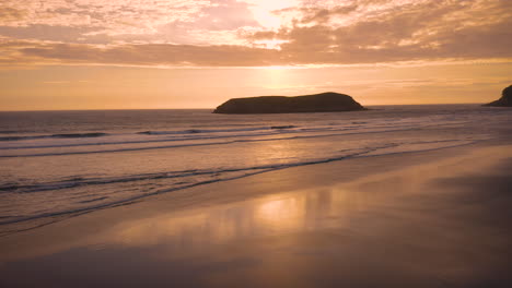 beautiful tranquil and serene waves rolling ashore at sunset
