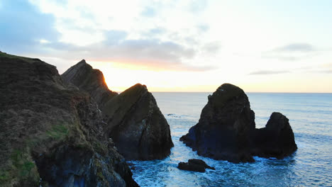 Rock-formation-in-sea-at-dusk-4k