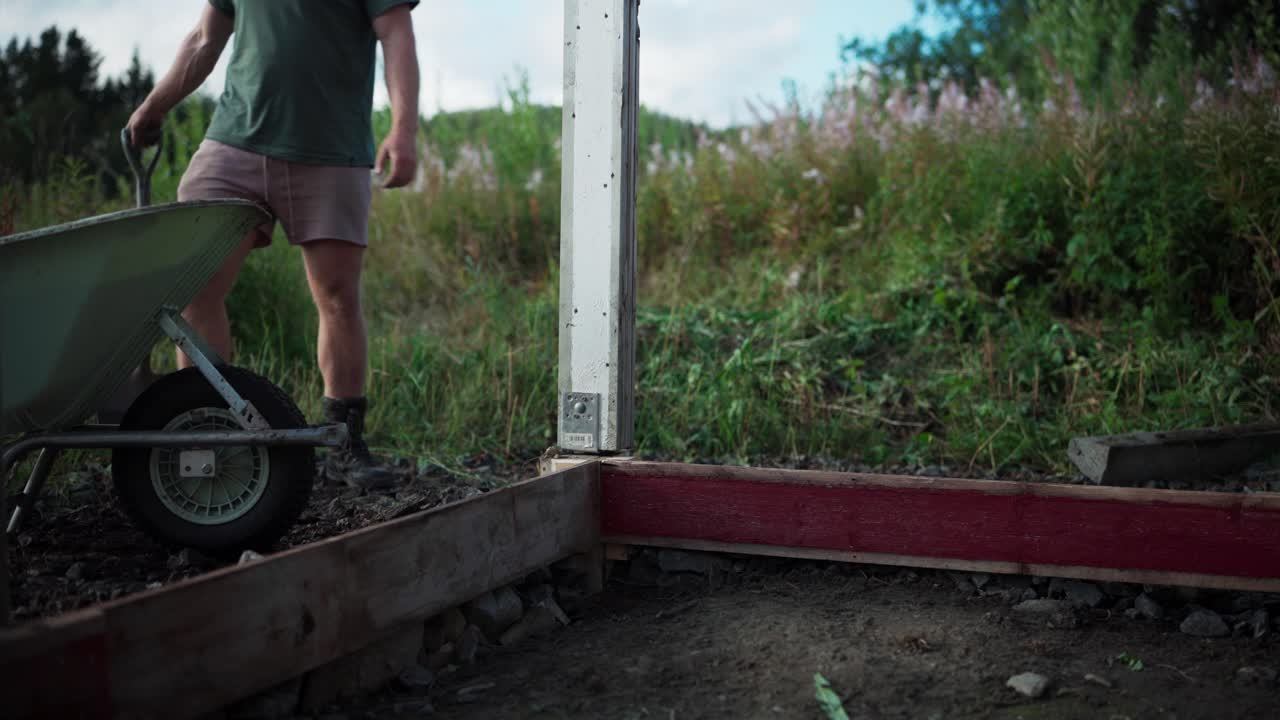 A Man in the Process of Building a Greenhouse in Indre Fosen, Trondelag County, Norway - Static Shot