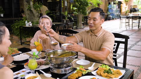 Family-talking-and-eating-in-chinese-restaurant