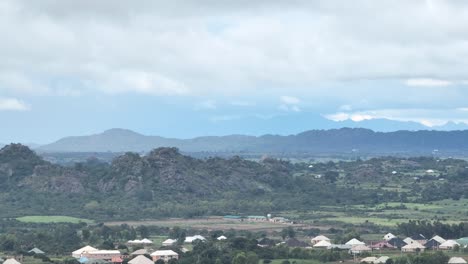 Shot-of-mountains-and-settlement,-forward-approach