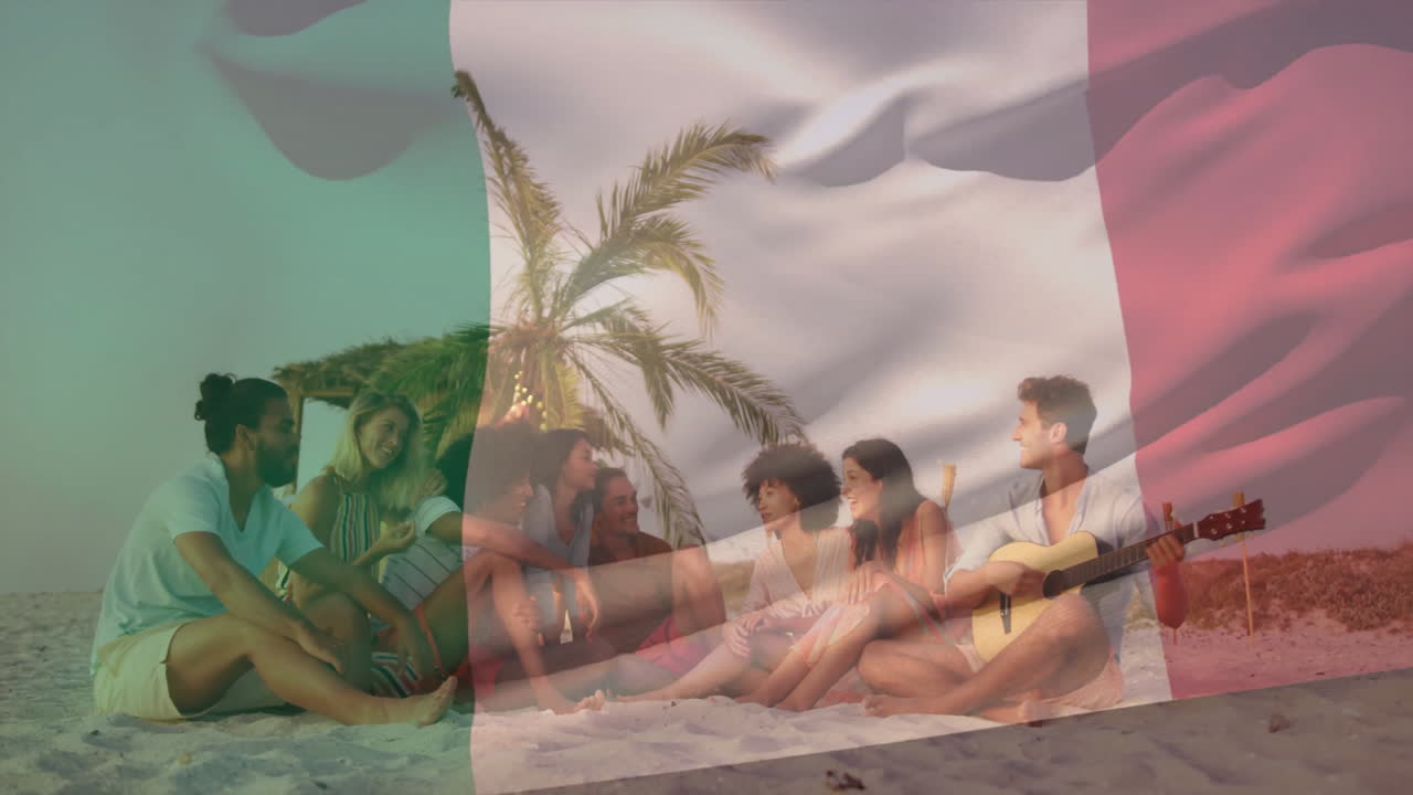 Playing guitar on beach, group of friends relaxing under palm tree