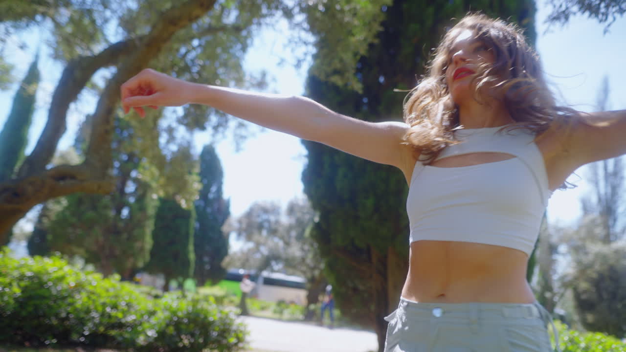 Woman Dancing in a Park