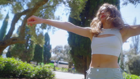 woman dancing in a park