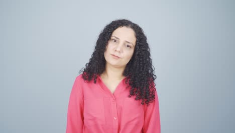 young woman looking depressed at camera.