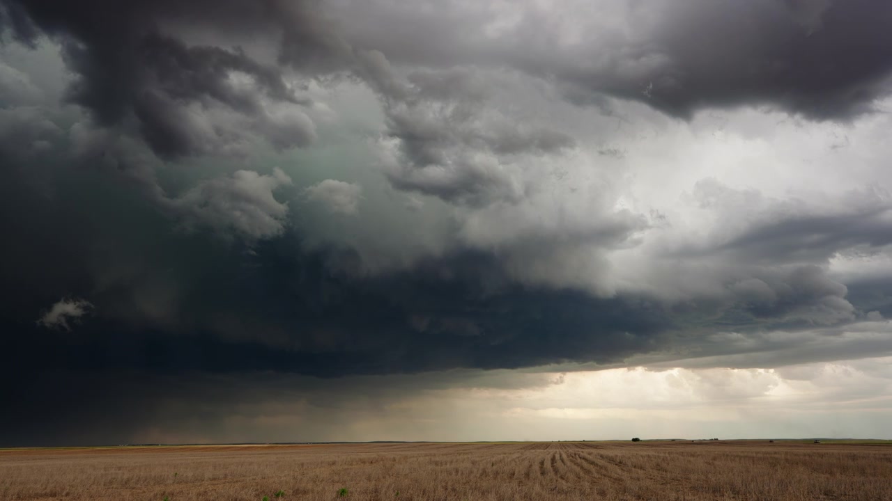 Beautiful 4K timelapse dramatic dark storm clouds roll through nature