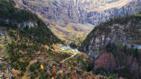 stunning view of gavarnie valley with lush greenery and cascading waterfall