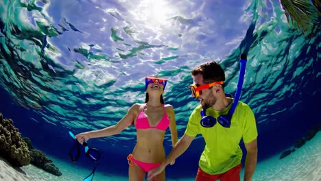 couple snorkeling underwater