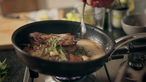 frying steak in a pan