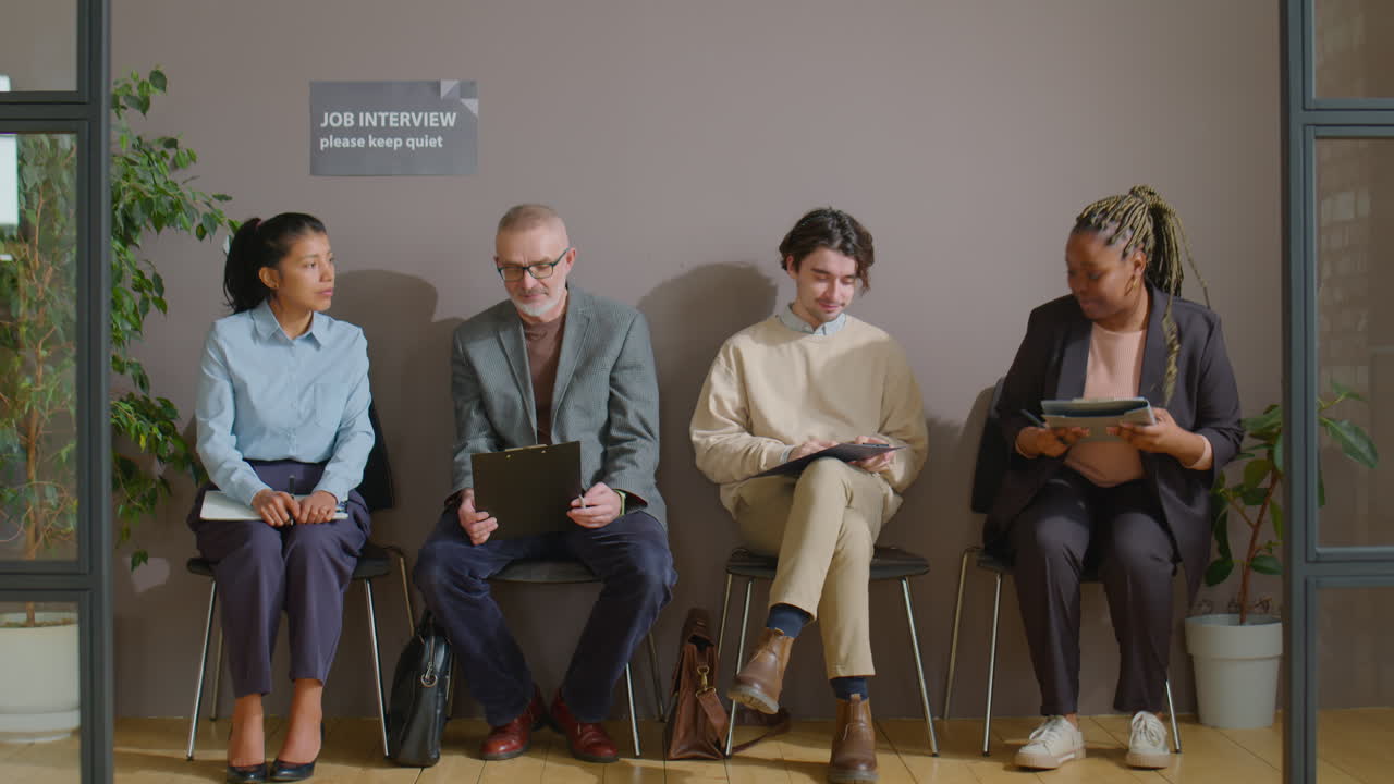 Multiethnic Candidates Speaking in Queue for Job Interview
