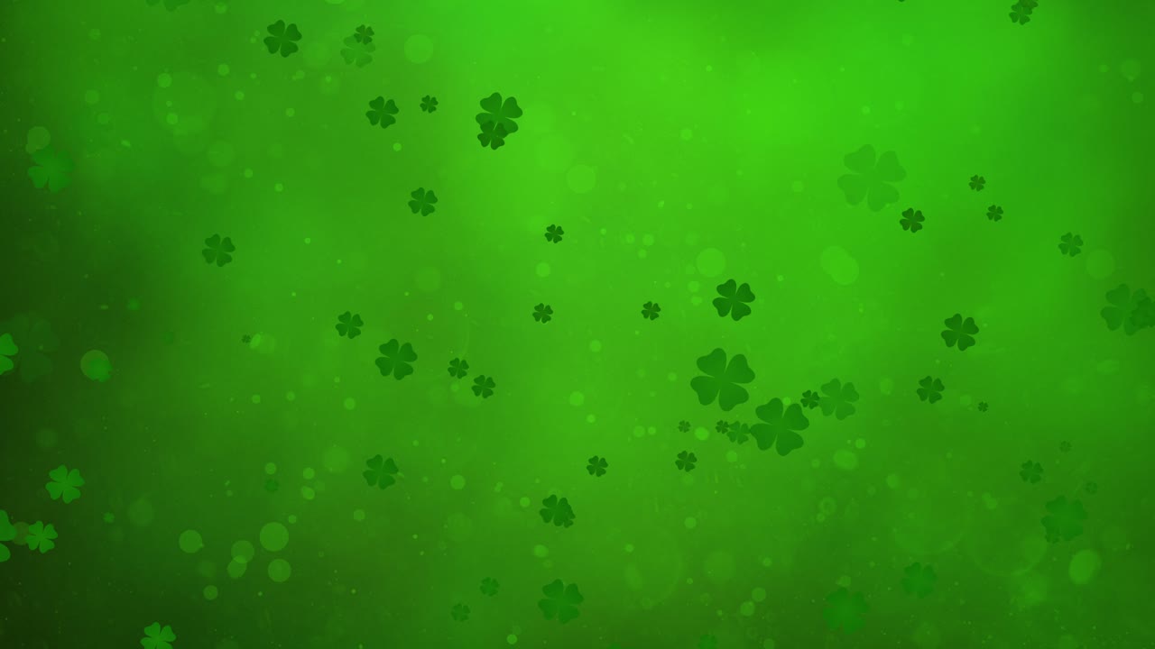 Saint Patrick's Day - Dancing Clovers on green background - Floating Shamrocks in motion