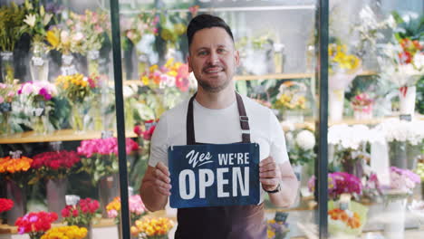 florist shop owner welcoming customers