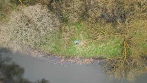 wild camping by the riverbanks in thetford forest, norfolk, uk