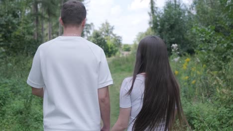 Couple walking together on a path in nature