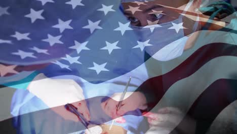 Animation-of-flag-of-united-states-of-america-waving-over-surgeons-in-operating-theatre