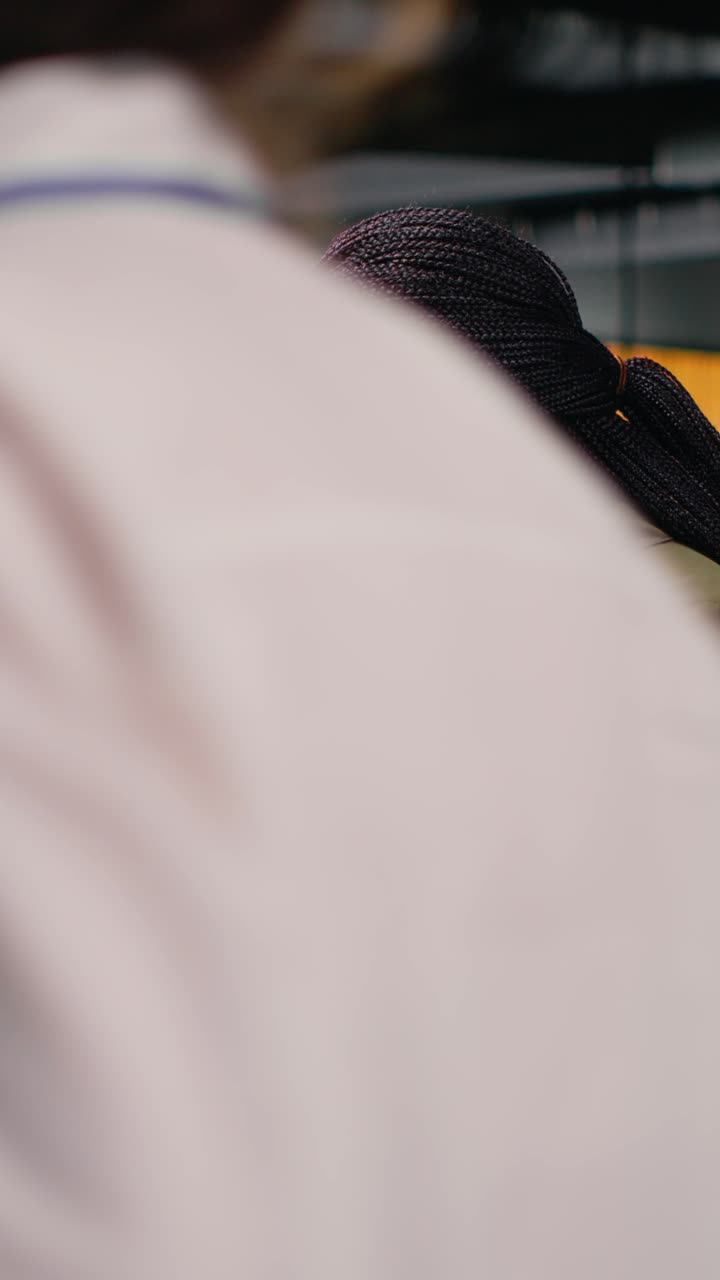 Vertical video Software developers working in AI startup training predictive models