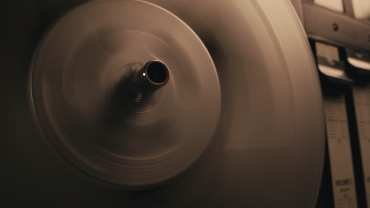 A vintage tape recorder in a pulsing light