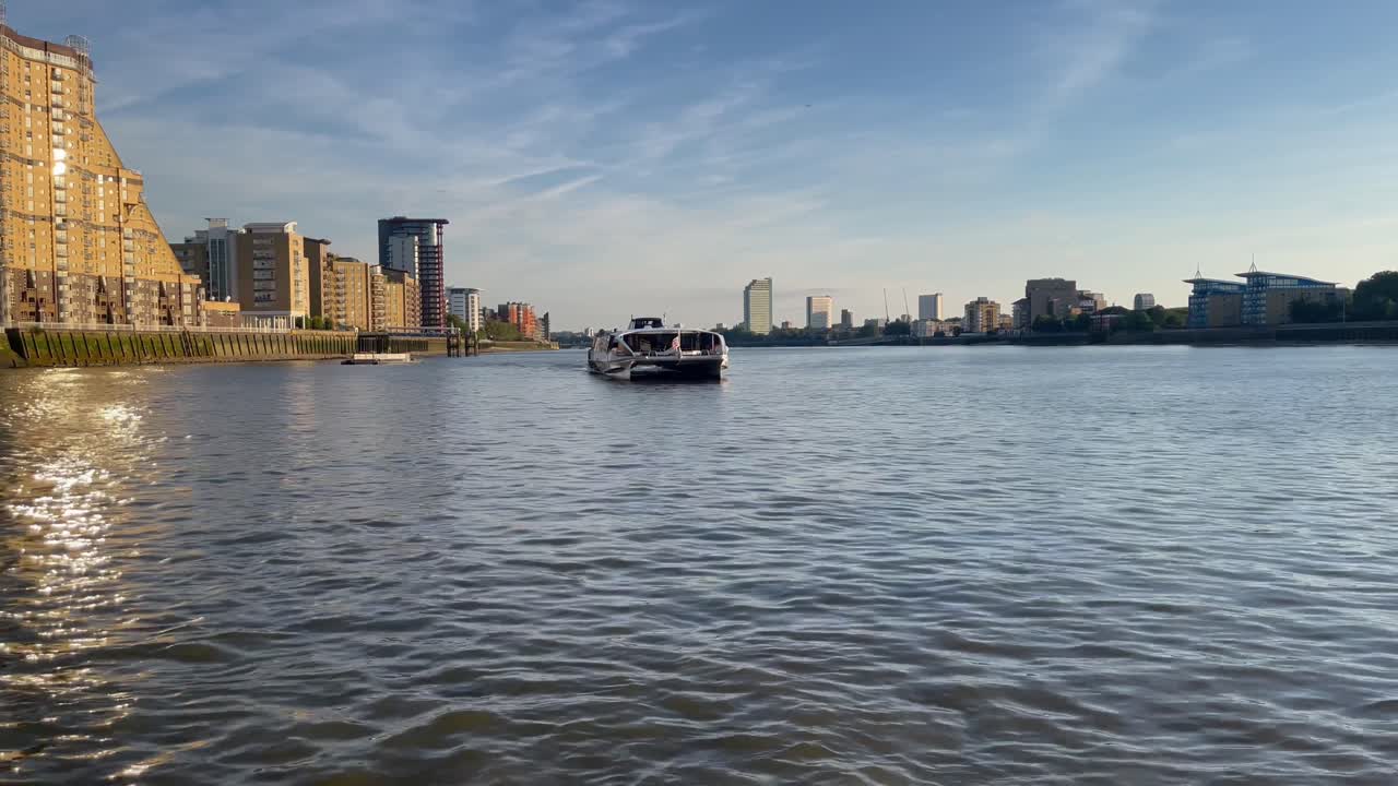 Breeze is soft, the current slow, Thames River waters beneath us flow