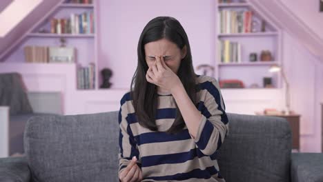 indian girl taking medicine in headache