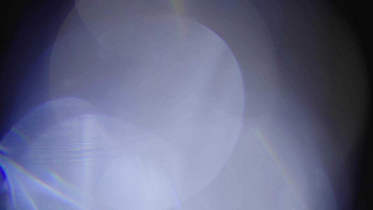 Abstract Blue and Purple Light Leaks with Lens Flares