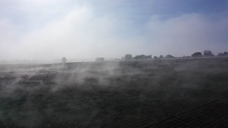 Aerial-Over-Misty-Countryside-Landscape-On-A-Sunny-Morning