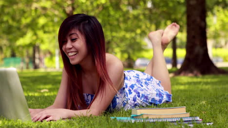 pretty student studying outside on campus