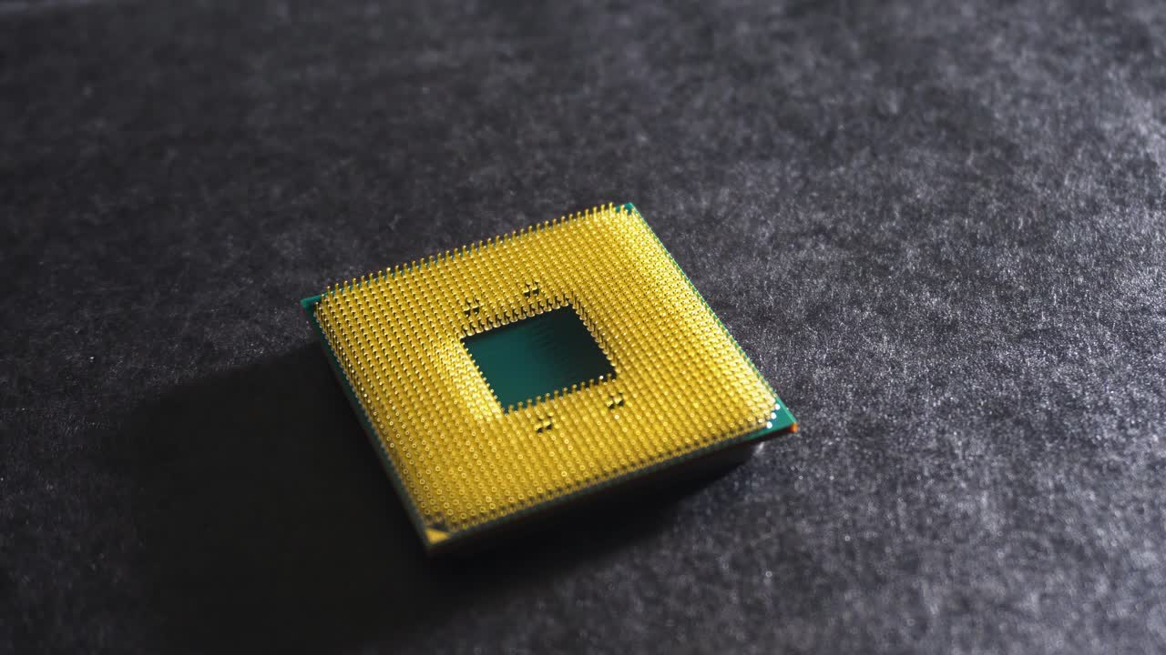 Green and yellow central processing unit (CPU), slow pan, wide close up