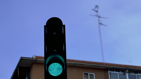 a red traffic light turning green