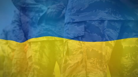 Animation-of-flag-of-ukraine-over-midsection-of-diverse-male-soldiers