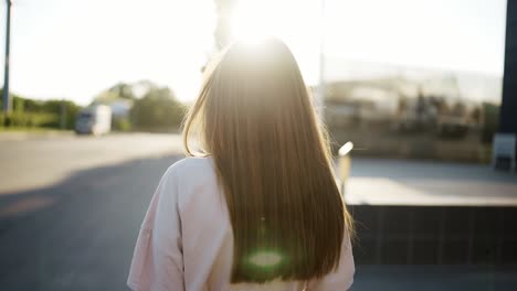 Portrait-of-gentle-female-person-looking-at-camera-and-spin