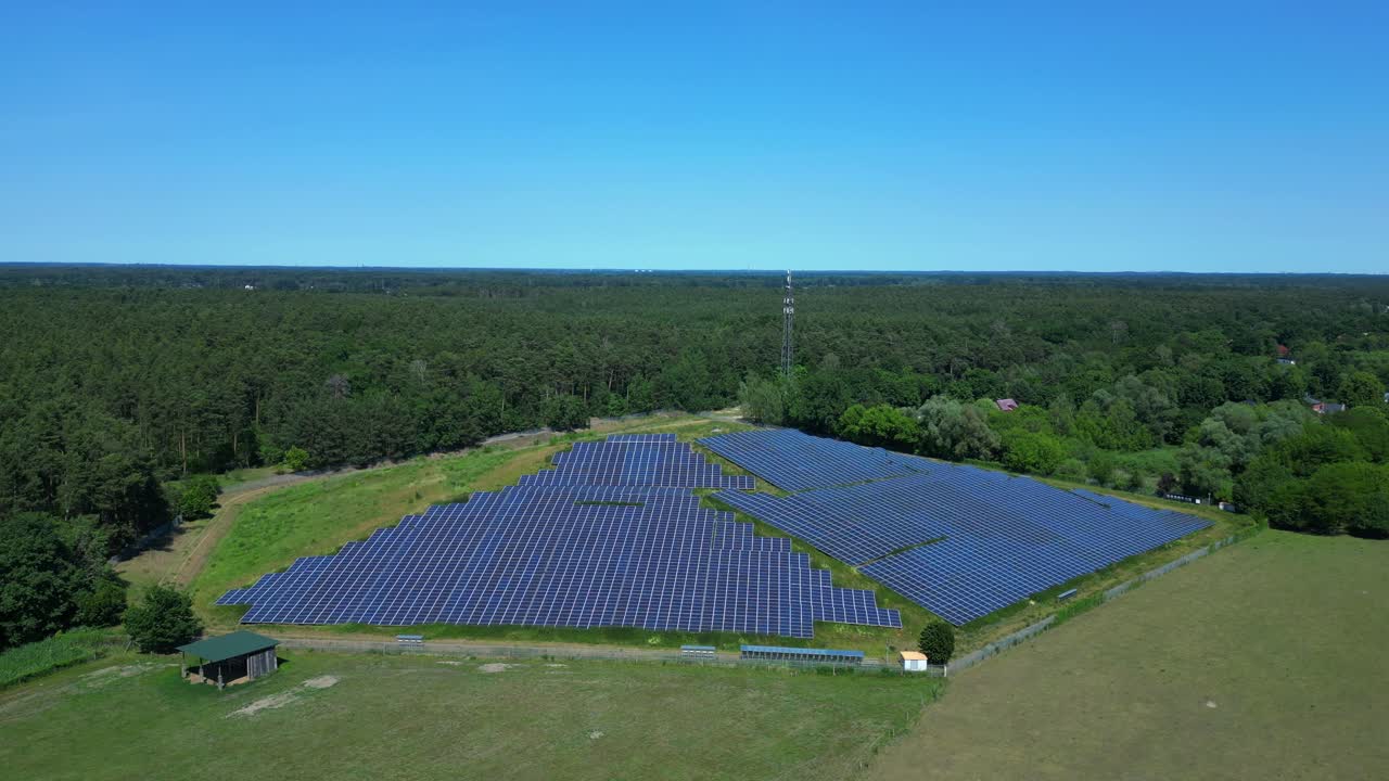 Photovoltaic panels installed on a former landfill, transforming a waste site into a source of renewable energy, a solution for the future. Gorgeous aerial view flight panorama overview drone