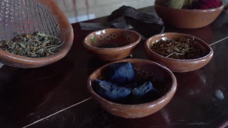 Slow-motion-shot-of-various-different-spices-in-separated-bowls-ready-to-cook