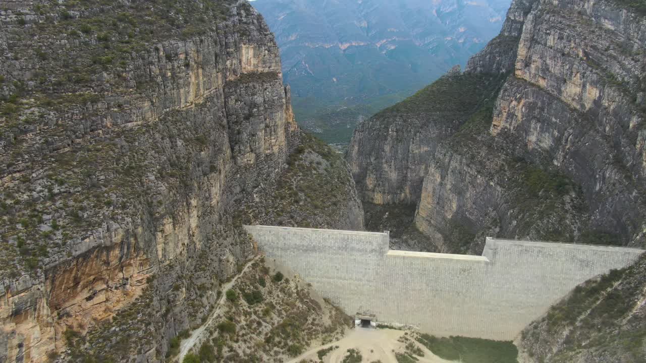 Construction of hydro-power dam on valley through rocky mountains of La Huasteca, Monterrey in Mexico