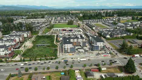 aerial view of cars driving along townhouse complex in langley, bc, canada