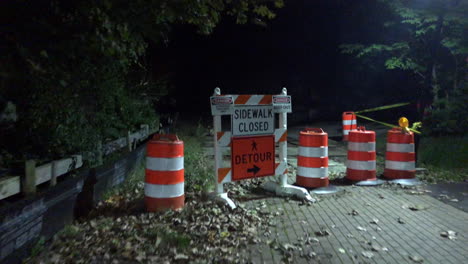 walking down a brick path towards a detour sign