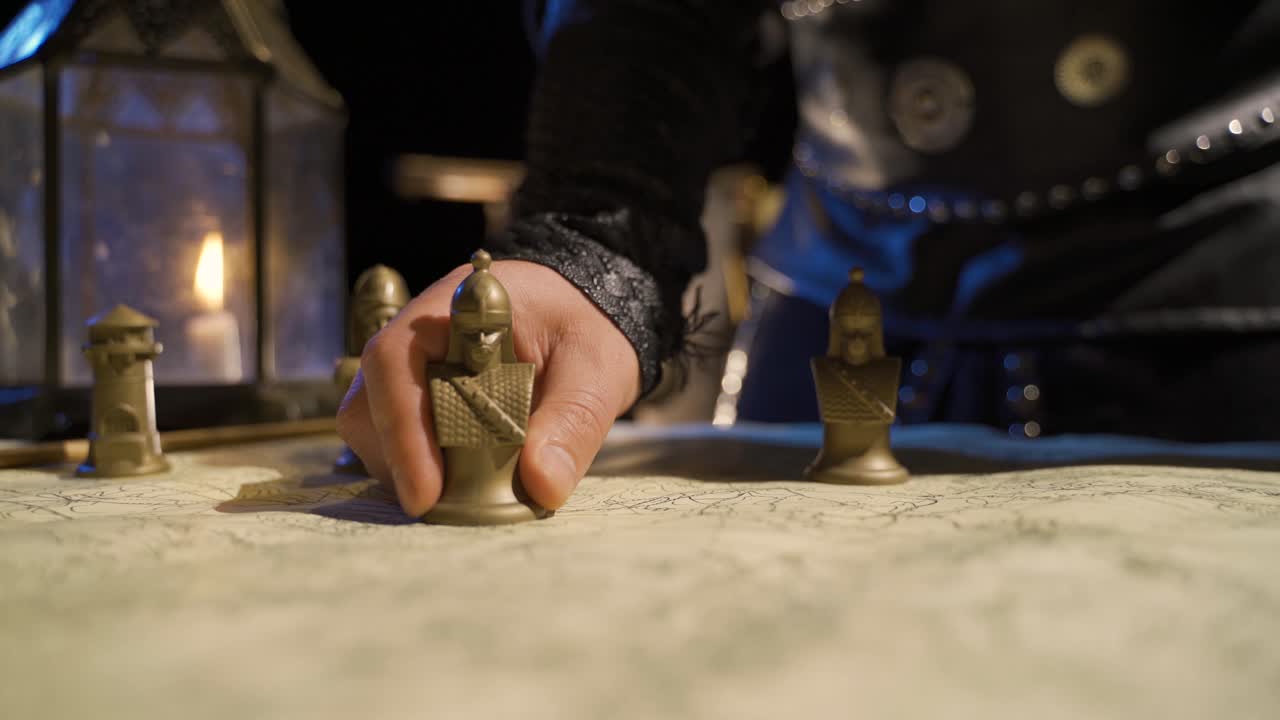 Making a conquest plan on the historical old map. Historical concept.