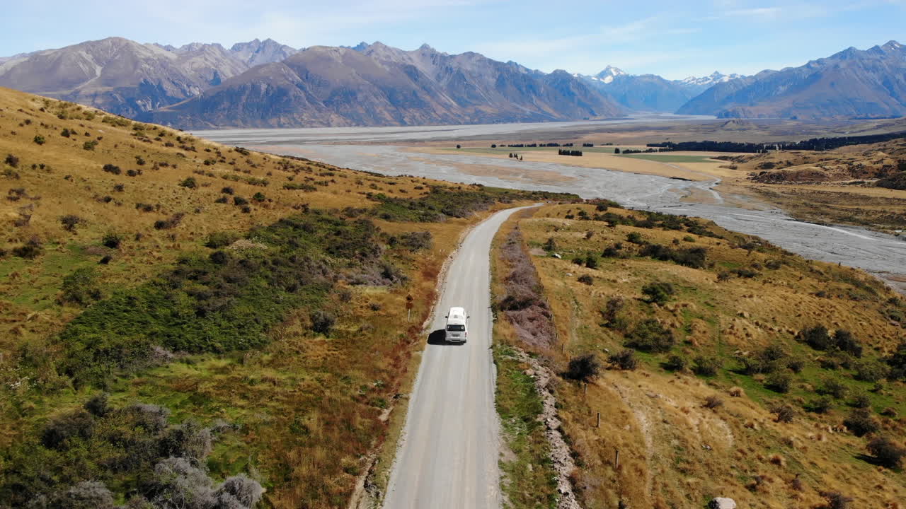Travel Van life New Zealand mountains and lake Drone following 4k