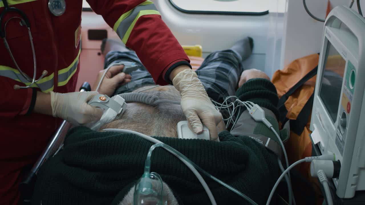 Paramedics Providing Emergency Medical Care in Ambulance