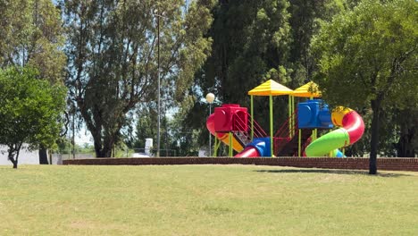 public park with children's games on a sunny day